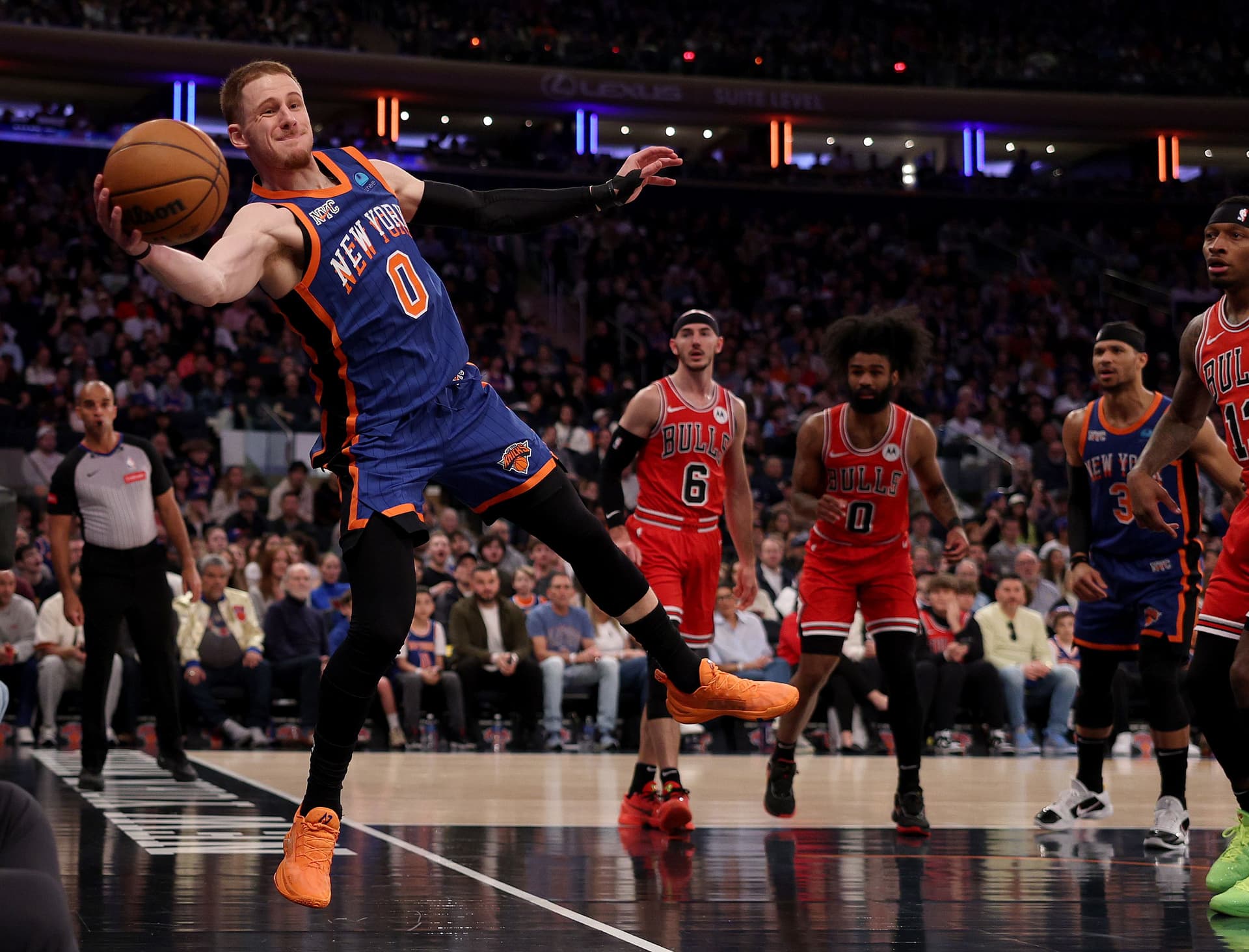 Donte DiVincenzo #0 of the New York Knicks keeps the loose ball in bounds