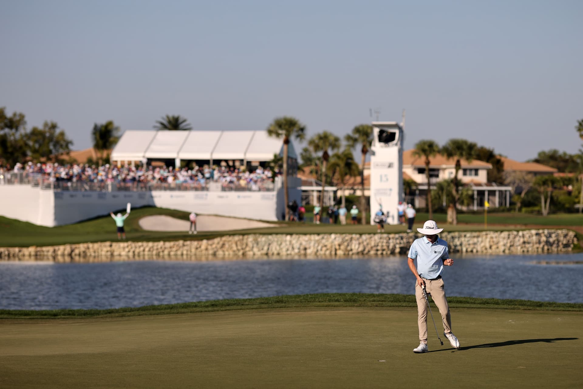 Joe Highsmith of the United States reacts to a putt on the 14th green