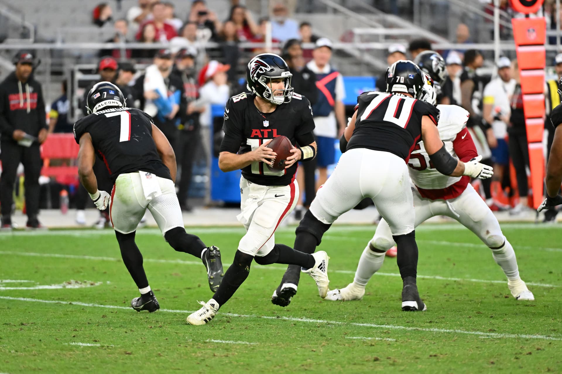Kirk Cousins #18 of the Atlanta Falcons looks to throw the ball against the Arizona Cardinals