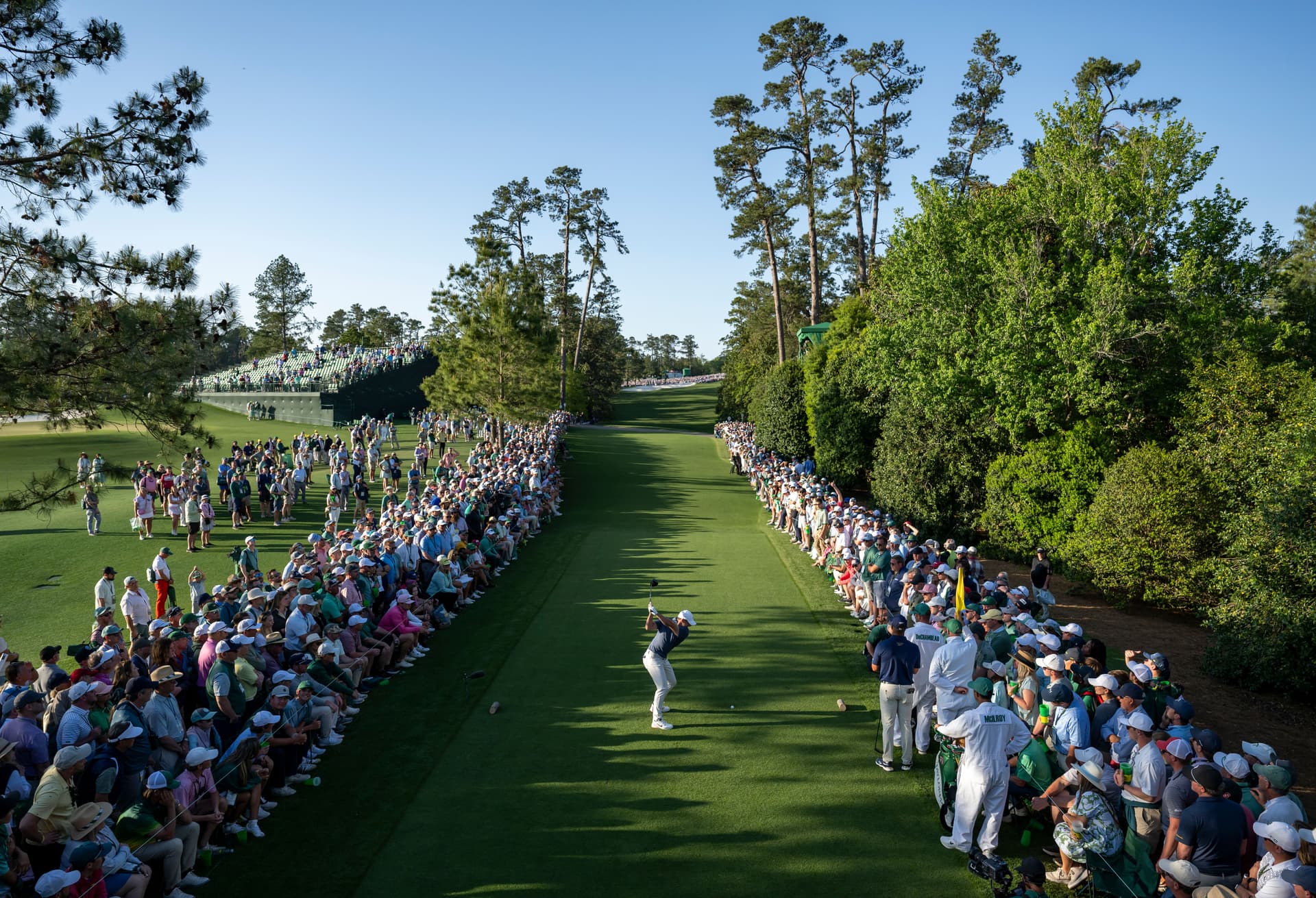 Masters champion Rory McIlroy of Northern Ireland plays a stroke from the No. 18 tee