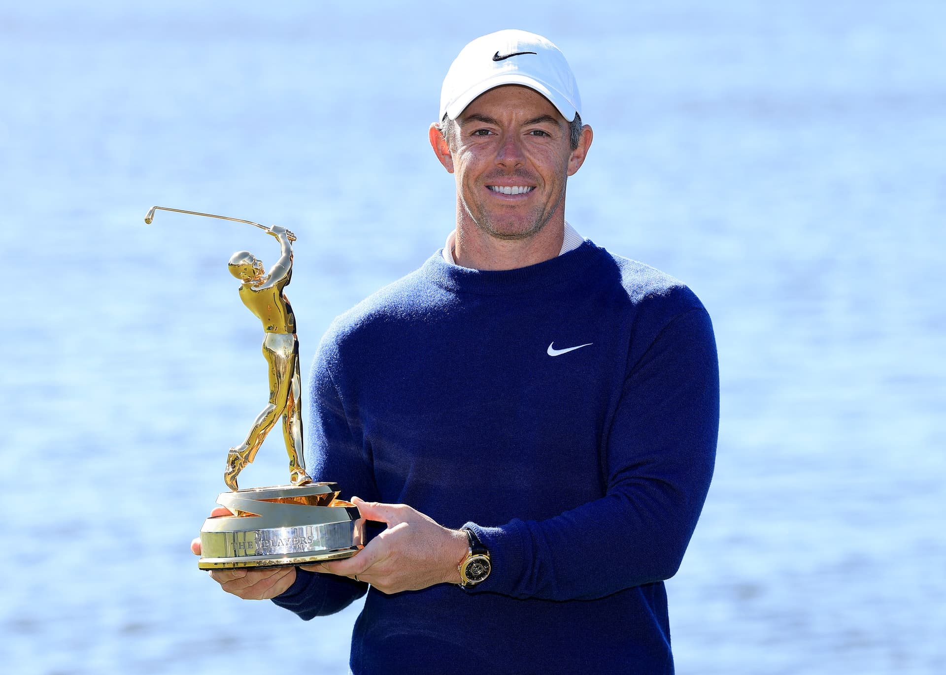Rory McIlroy of Northern Ireland holds the Players trophy