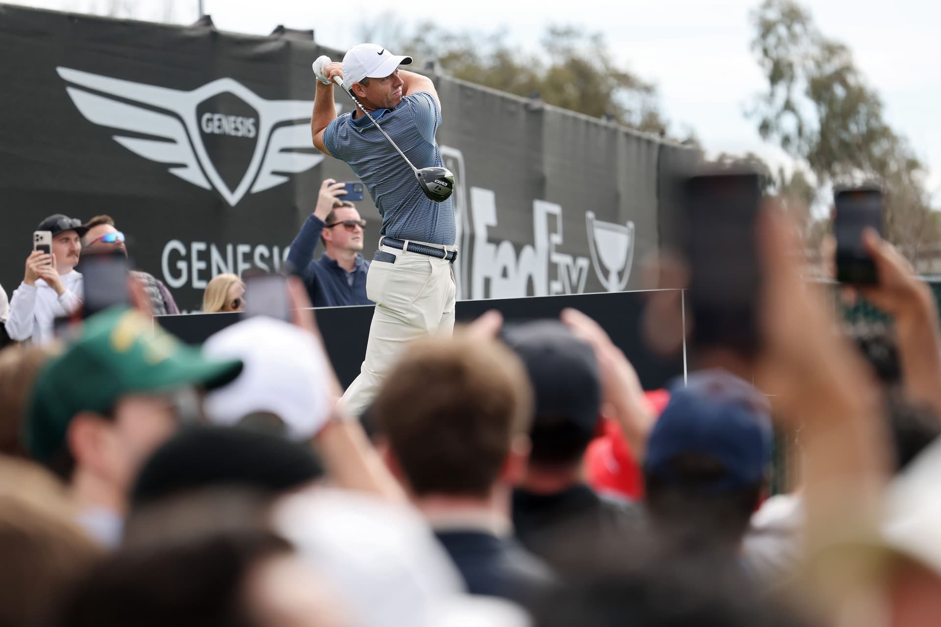 Rory McIlroy of Northern Ireland plays his shot from the 12th tee