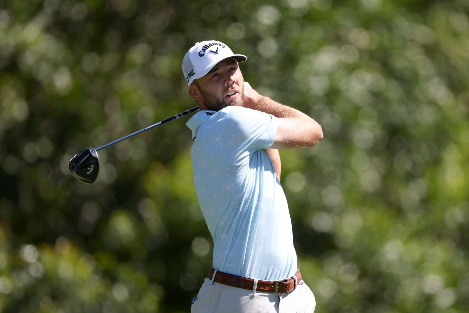 Sam Burns of the United States plays his shot from the ninth tee during the second round